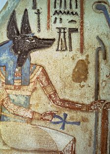 Detail of god Anubis in a familiar stela from a chapel of worship