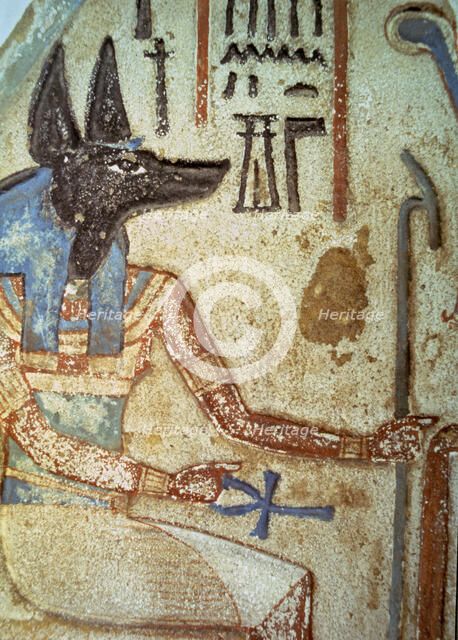 Detail of god Anubis in a familiar stela from a chapel of worship.