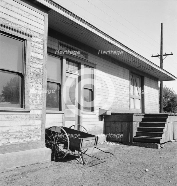 Detail of railroad station painted "railroad yellow", Irrigon, Morrow County, Oregon, 1939. Creator: Dorothea Lange.