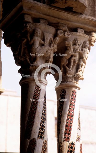 Detail of two capitals with carved figures with allegorical and religious decoration, and columns…