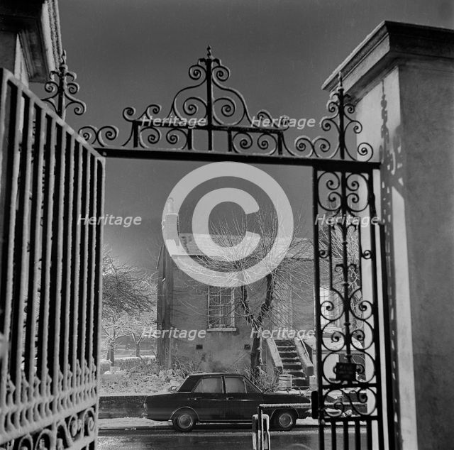 Detail of the wrought iron gate and overthrow at the Old Hall, Highgate, London, 1967. Creator: John Gay.