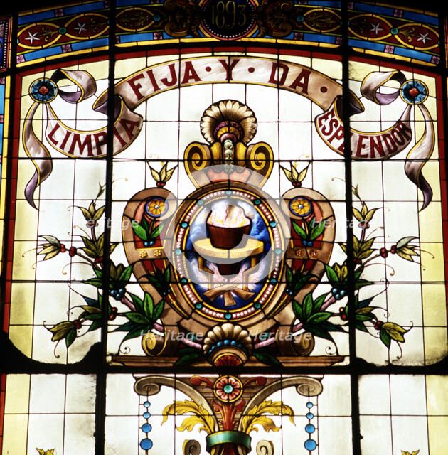 Detail of the badge of the Royal Spanish Language Academy with the motto 'Limpia, fija y da esple…