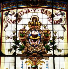 Detail of the badge of the Royal Spanish Language Academy with the motto Limpia, fija y da esple…