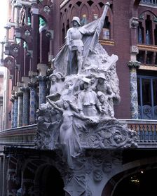 Detail of the exterior of the Palau de la Música Catalana (1905-1908), with the Sculpture group …