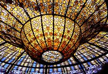 Detail of the Modernist stained glass window in the roof of the Palau de la Música Catalana in Ba…