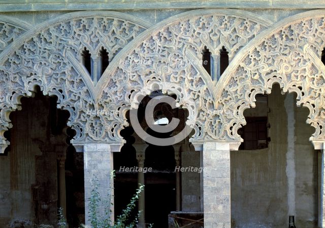 Details of the decoration of the columns' arches in a room of the Aljafería Palace in Zaragoza.