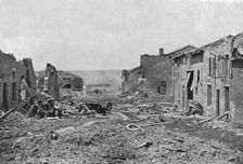 Devant Verdun; La rue principale de Fleury-devant-Douaumont: les deux camions don’t..., 1916. Creator: Unknown