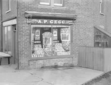 Decorated shop window of AP Gegg, c1935. Creator: Kirk & Sons of Cowes