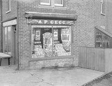 Decorated shop window of AP Gegg, c1935. Creator: Kirk & Sons of Cowes
