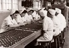 Decorating chocolates by hand, Rowntree factory, York, Yorkshire, 1956