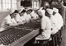 Decorating chocolates by hand, Rowntree factory, York, Yorkshire, 1956