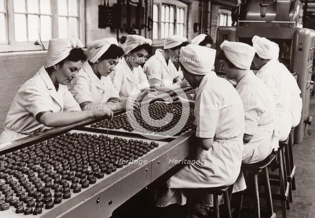 Decorating chocolates by hand, Rowntree factory, York, Yorkshire, 1956. Artist: Unknown