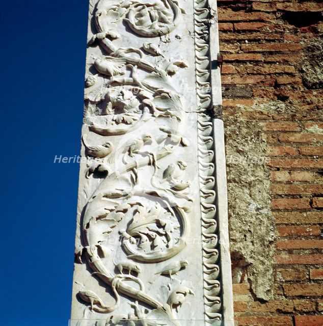 Decoration on the jamb of the dooway of the Building of Eumachia in the Forum, Pompeii, Italy. Creator: Unknown.