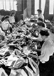 Decorations for the King's visit: making union jacks, 1909. Creator: Unknown