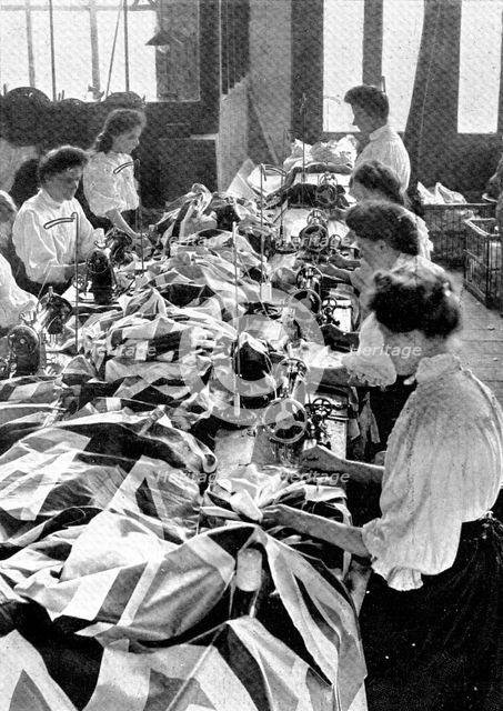 Decorations for the King's visit: making union jacks, 1909. Creator: Unknown.