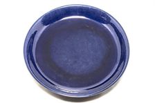 Deep aubergine dish with carved dragons chasing flaming pearl, 1662-1722