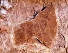 Deer lying on the right, Painted in red with spot colors. 37cms. Levantine Art, from the Canyon o…