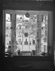 DeLamar, Alice, Miss, house window display, between 1927 and 1942. Creator: Arnold Genthe