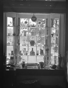 DeLamar, Alice, Miss, house window display, between 1927 and 1942. Creator: Arnold Genthe