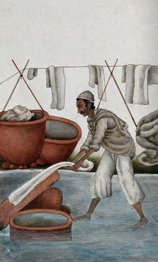 Delhi: a washerman washing clothes, (between 1800 and 1899?). Creator: Unknown