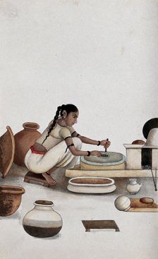 Delhi: a woman grinding grain into flour, (between 1800 and 1899?). Creator: Unknown