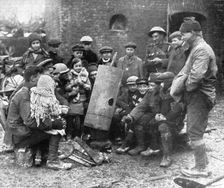 Delivres ! ; La population enfantine d'un village libere se presse autour d'un brasero improvise pa Creator: Unknown