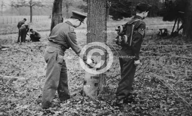 Demonstration of how to place limpet mines, c1943. Creator: British Government.