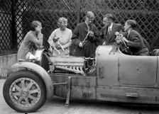 Denis Evans inspecting the plugs of his Bugatti Type 43 2262cc. Artist: Bill Brunell