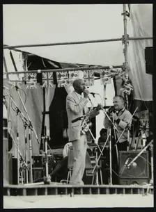 Denis Williams photographing Eddie Cleanhead Vinson at Knebworth, Hertfordshire, 1981. Creator: Unknown