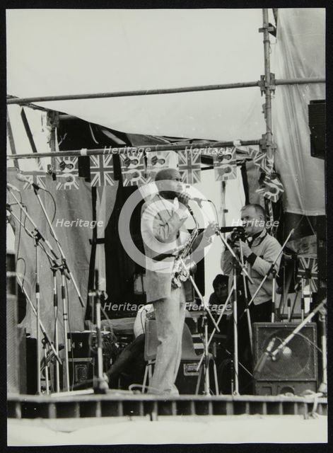 Denis Williams photographing Eddie 'Cleanhead' Vinson at Knebworth, Hertfordshire, 1981. Artist: Unknown
