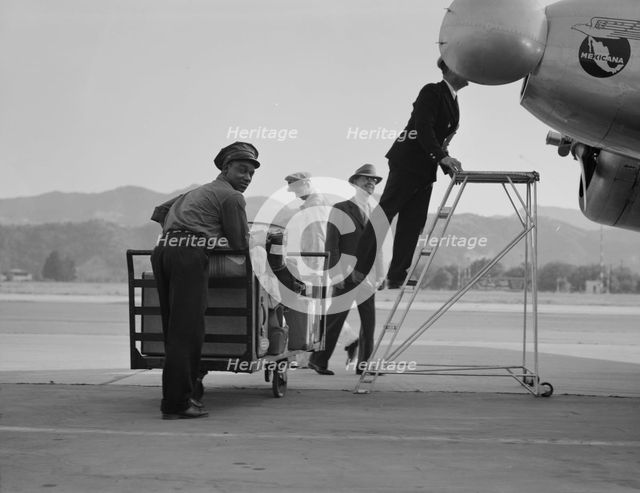 Department of Agriculture plant quarantine inspectors, Glendale Airport, California, 1937. Creator: Dorothea Lange.