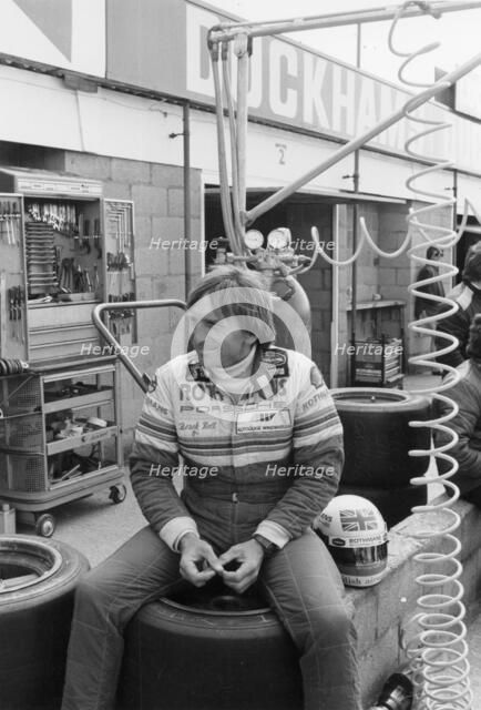 Derek Bell in the pits. Artist: Unknown