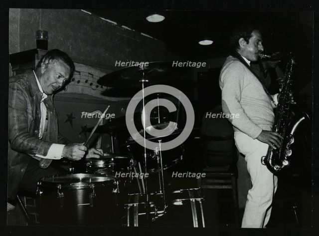 Derek Hogg (drums) and Bobby Wellins (saxophone) playing at The Bell, Codicote, Hertfordshire, 1985. Creator: Denis Williams.