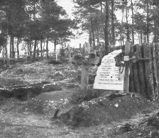 Derriere L'ennemi refoule; Un cimetiere allemande: au premier plan, deux tombes...1915 (1924).. Creator: Unknown