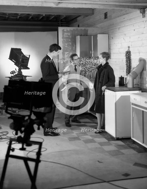 Designer in a photographic studio, Mexborough, South Yorkshire, 1964. Creator: Michael Walters.