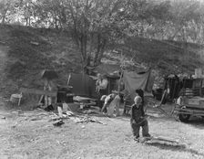 Destitute family, American River camp, near Sacramento, California., 1936. Creator: Dorothea Lange