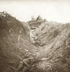 Destroyed tank and dead body, Auberives, France, c1914-c1918