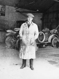 DF Bentley standing in front of a Bentley car, 1921