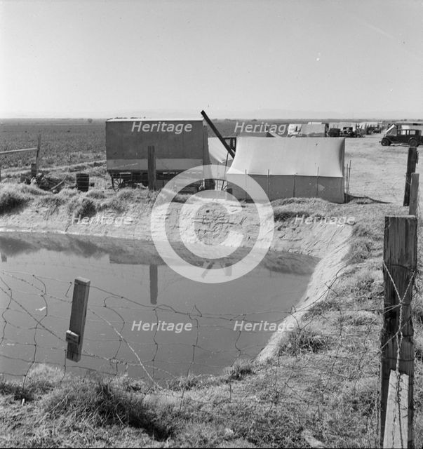 Ditch bank camp for migrant agricultural workers, California, 1937. Creator: Dorothea Lange.