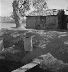 Ditch bank housing for Mexican field workers, Imperial Valley, California, 1937. Creator: Dorothea Lange