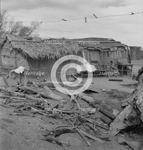 Ditch bank housing for Mexican field workers, Imperial Valley, California, 1937. Creator: Dorothea Lange.