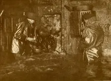 Divers Plugging A Leak During Salvage Operations Waist-Deep In Water On the Lower Decks Of The Germ Creator: Unknown