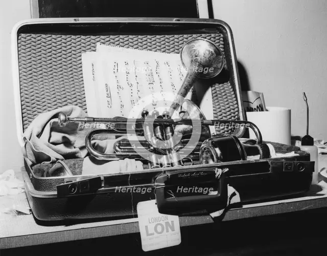 Dizzy Gillespie, trumpet in case, Manchester, 1963. Creator: Brian Foskett.
