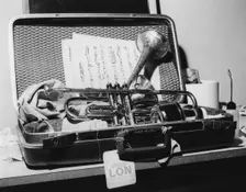 Dizzy Gillespie, trumpet in case, Manchester, 1963. Creator: Brian Foskett