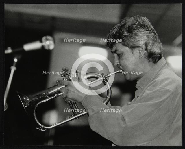 Dick Pearce playing the flugelhorn at The Fairway, Welwyn Garden City, Hertfordshire, 1999. Artist: Denis Williams