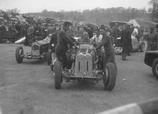 Dick Seaman's ERA, Dick Shuttleworth's Alfa Romeo and a MG Magnette at Donington Park, 1935. Artist: Bill Brunell