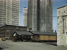 Diesel switch engine moving freight cars...South Water street...Illinois Central R.R., Chicago, 1943 Creator: Jack Delano