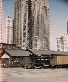 Diesel switch engine moving freight cars at the South water...Illinois Central R.R., Chicago, 1943. Creator: Jack Delano