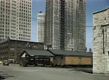 Diesel switch engine moving freight cars...South Water street...Illinois Central R.R., Chicago, 1943 Creator: Jack Delano