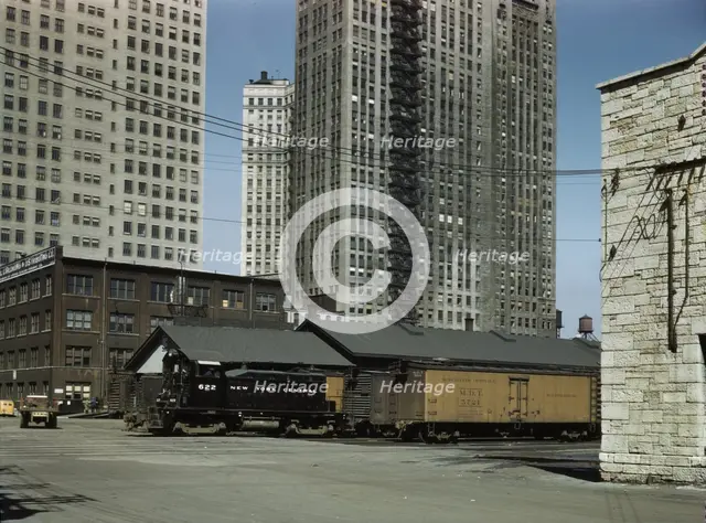 Diesel switch engine moving freight cars...South Water street...Illinois Central R.R., Chicago, 1943 Creator: Jack Delano.
